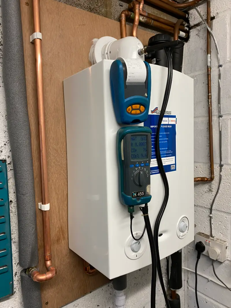 Flue gas analyser connected to a Worcester boiler during an annual service by Homely Heating Group